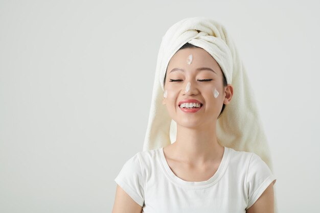 Woman Applying Moisturizing Lotion