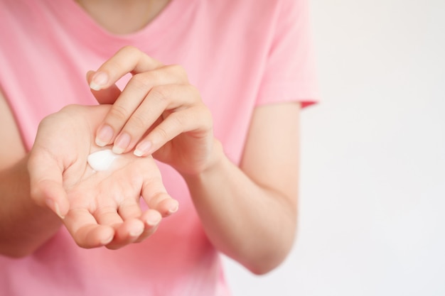 Woman applying a skin care cream