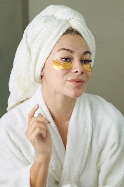 Woman Applying Smoothing Undereye Patches