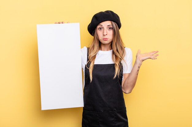 Photo woman artist feeling puzzled and confused and doubting empty canvas concept