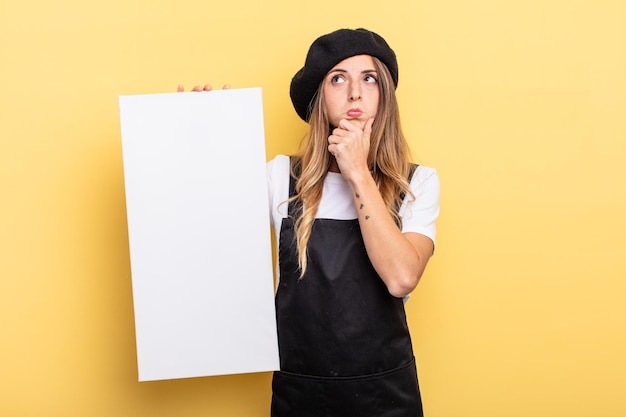 Woman artist thinking feeling doubtful and confused empty canvas concept