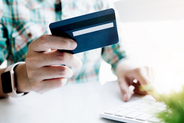 Woman asian making online payment on laptop computer with credit card