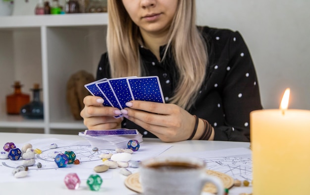 woman astrologer draws a natal chart selective focus