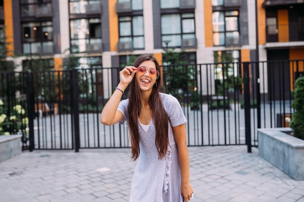 Woman on the background of large building