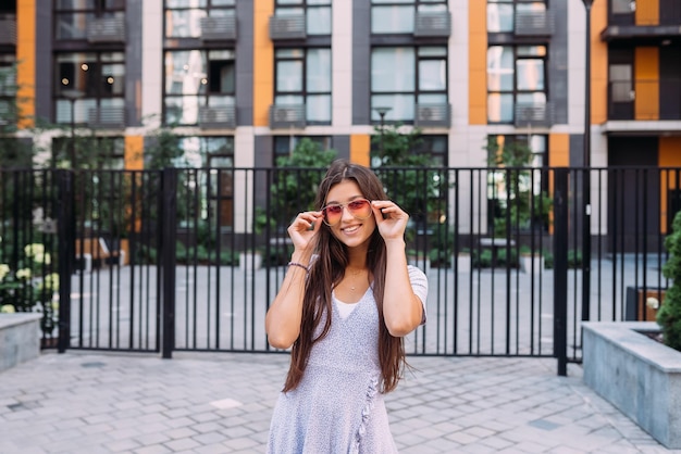 Woman on the background of large building