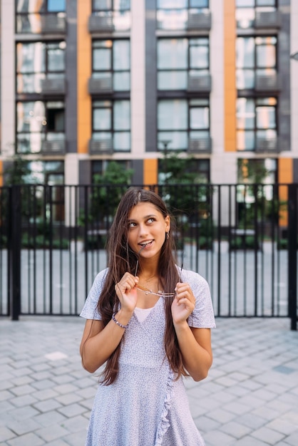 Woman on the background of large building