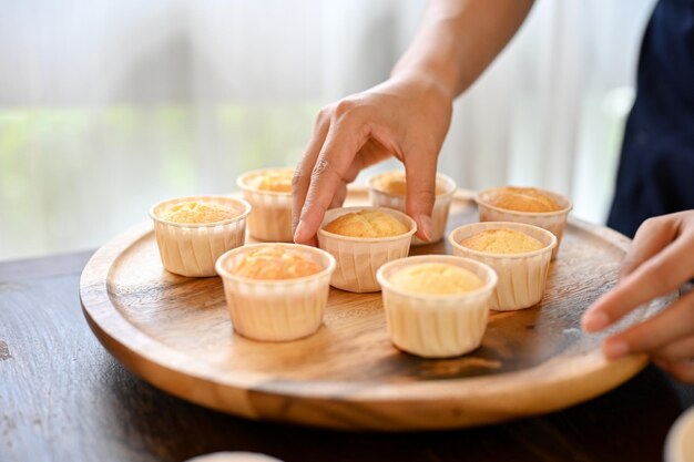 Woman baking cupcake in the kitchen in her free time