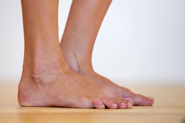 Woman bare feet on the floor