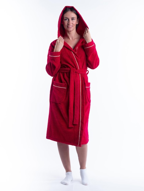 Woman in a Bathrobe on an isolated white background with a smile on her face