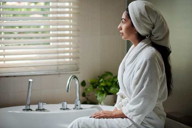 Woman in Bathrobe and Towel on Head