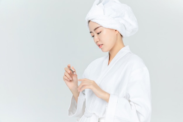 Woman in bathrobe with makeup