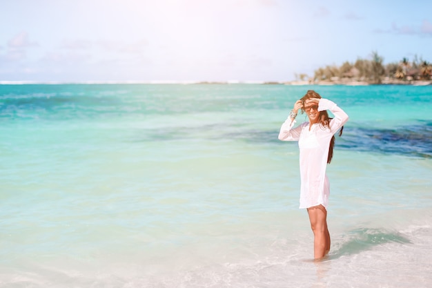 Woman on the beach enjoying summer holidays