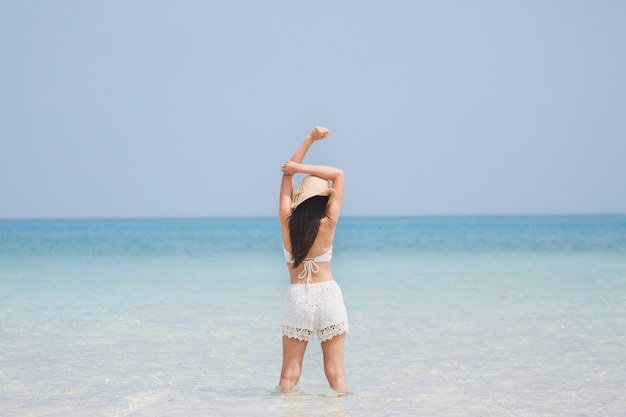 Woman on beach in summer