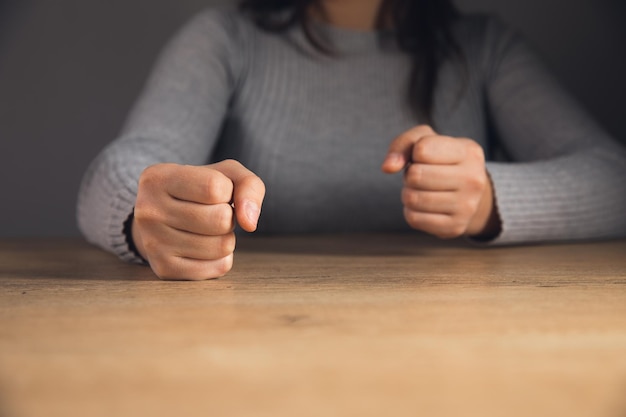 Woman beating her fists