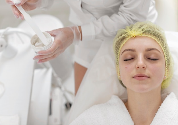 woman at beauty clinic for face treatment