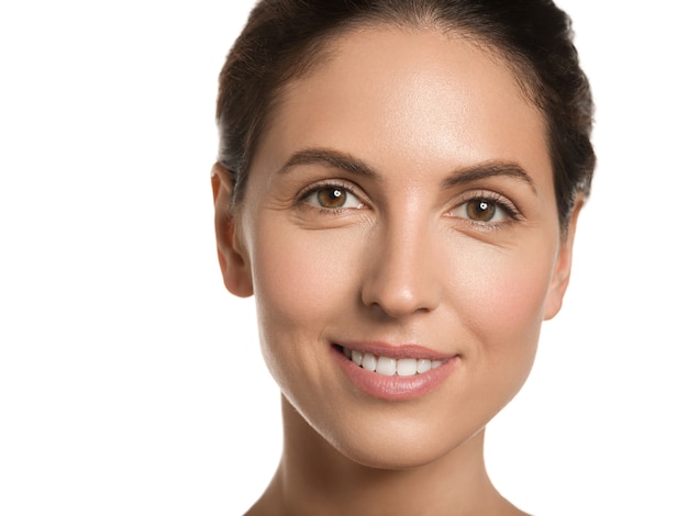 Woman beauty face healthy skin natural clean fresh face. Close up view. Color background. Brown