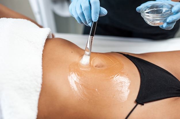 Woman beauty procedure in spa salon