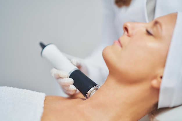 Woman in a beauty salon having face and body treatment