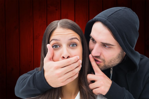 Photo woman being attacked by scary man against wooden planks