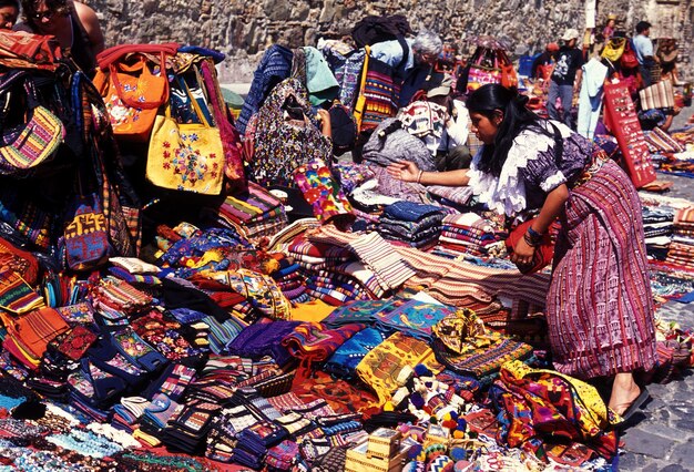 Woman bending at market stall