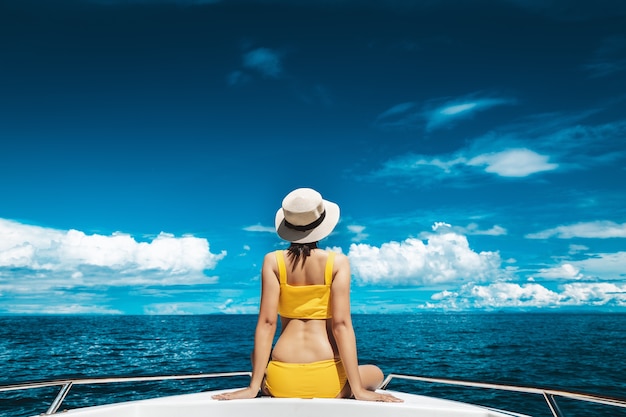 Woman in bikini relaxing on a boat