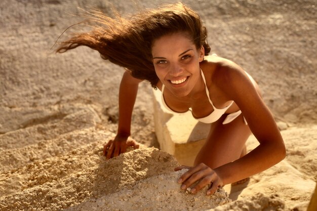 woman in bikini on the rock