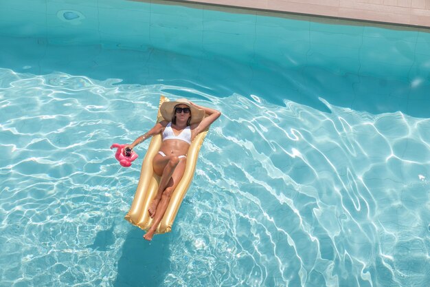 Woman in bikini swimming pool