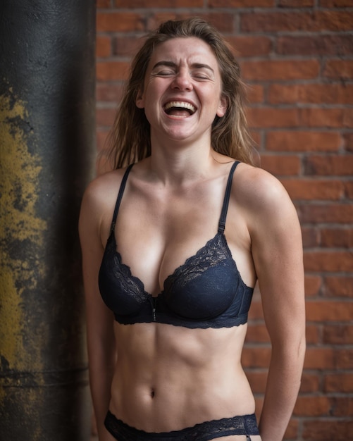 A woman in a black bra and panties laughing