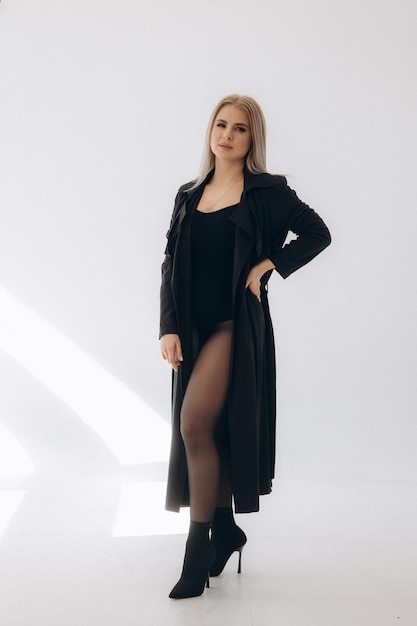 Woman in a black dress and black tights