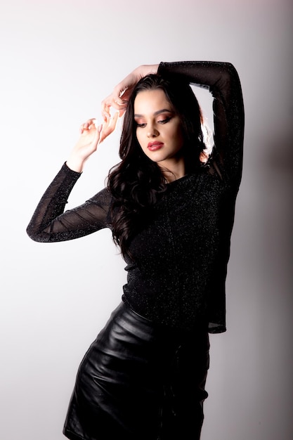 Woman in black dress on white background