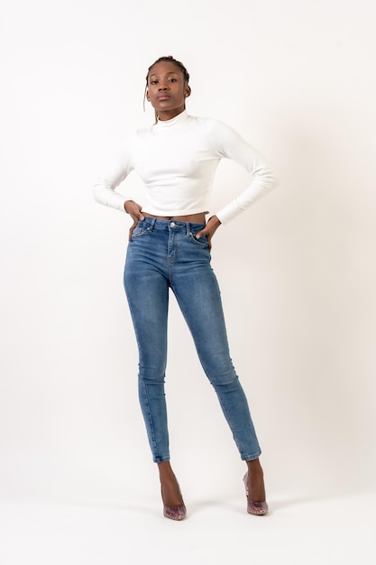 Woman of black ethnicity portrait in studio on a white background