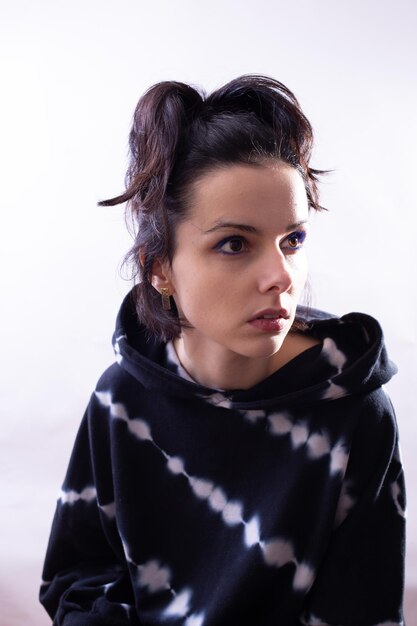 woman in black sweatshirt portrait on white background