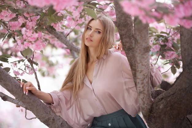 Woman at Blossoming Sakura Tree on Nature