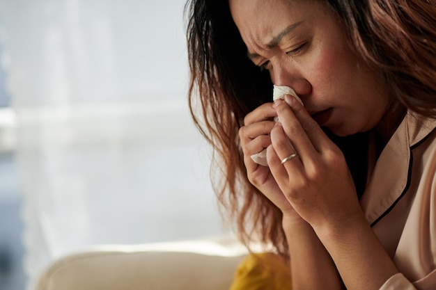 Woman Blowing Nose