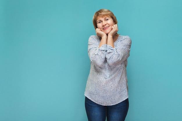 A woman on a blue background shows different emotions