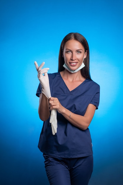 Woman in a blue surgical suit