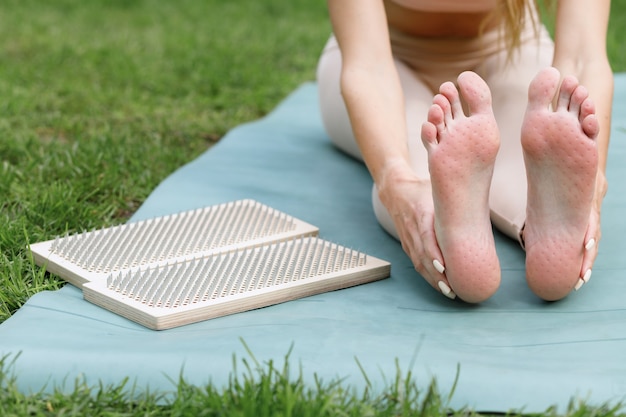 Woman and board sadhu on the mat in the summer