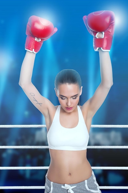 Woman in boxing gloves and sportswear