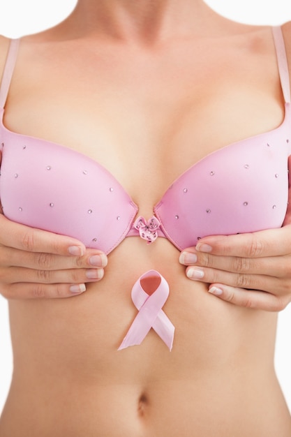 Photo woman in bra with breast cancer awareness ribbon