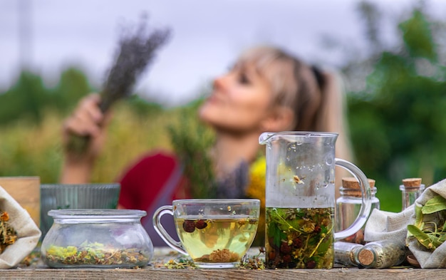 woman brews herbal tea Selective focus