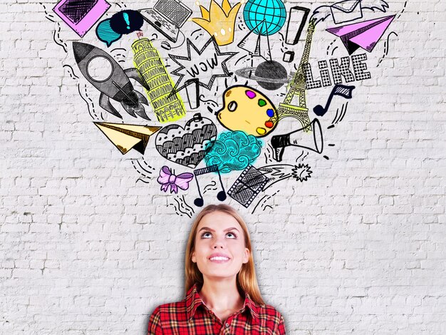 Woman on brick background with sketches