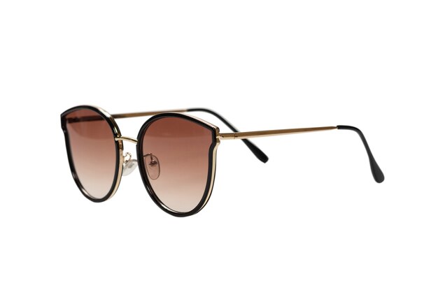 Woman brown trendy sunglasses isolated on a white surface.