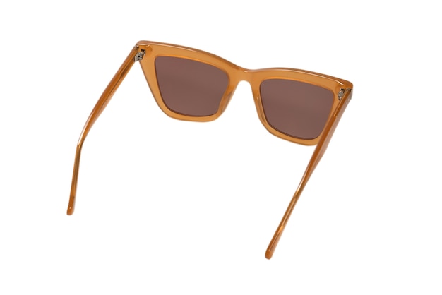 Woman brown trendy sunglasses isolated on a white surface.