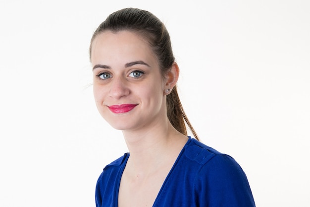 Woman, brunette with a blue top smiling at the camera