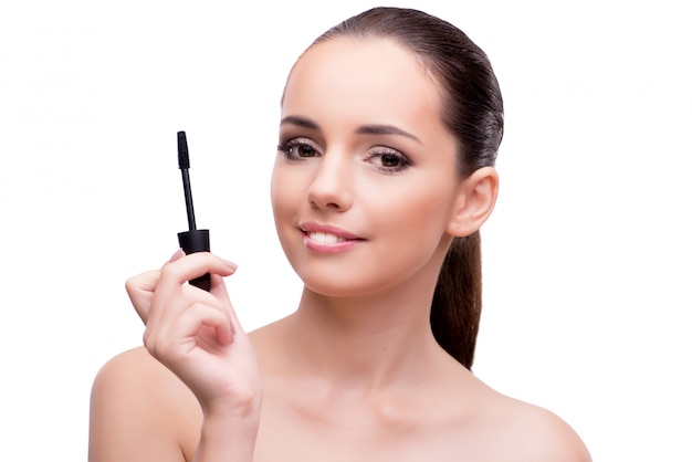 Woman brushing eyelashes isolated on white