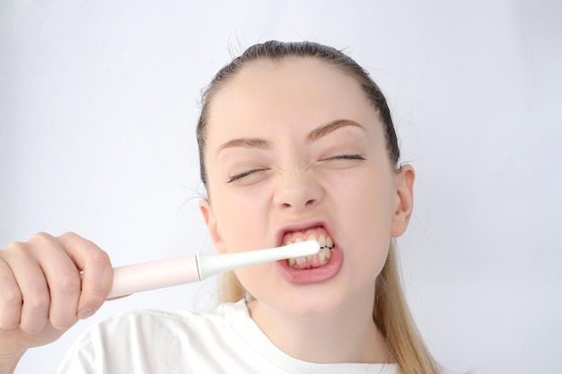 woman brushing her teeth
