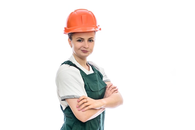 Woman builder in helmet isolated on white