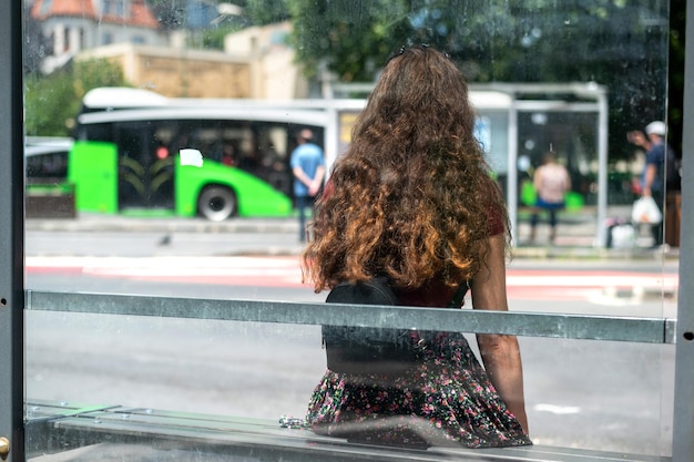 A woman at a bus station in Brasov Romania