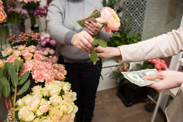 Woman buying flowers from a florist