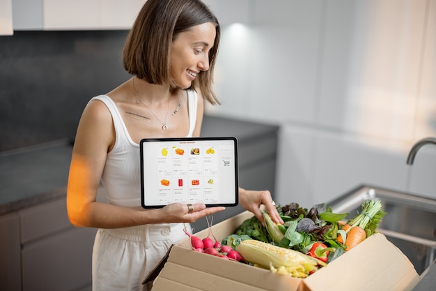 Woman buying fresh vegetables online